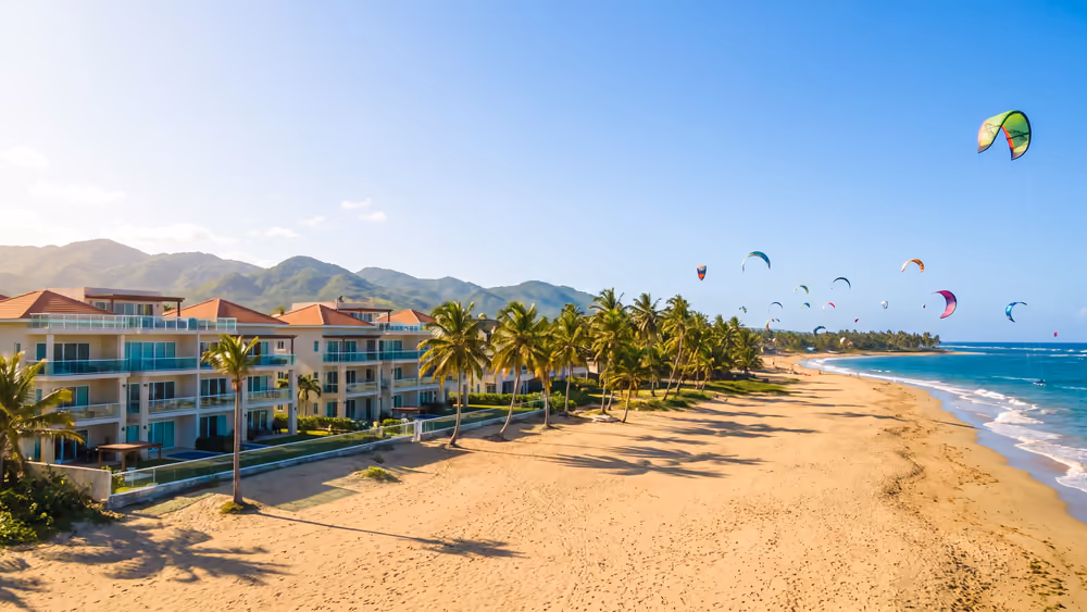 Cabarete beach in Puerto Plata with kitesurf kites and mountains behind