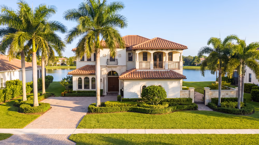 Mediterranean-style single-family home on a lake in a Weston, Florida community